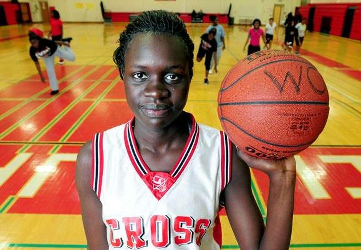 Family members - including Bol Bol, center, who is 10 years old