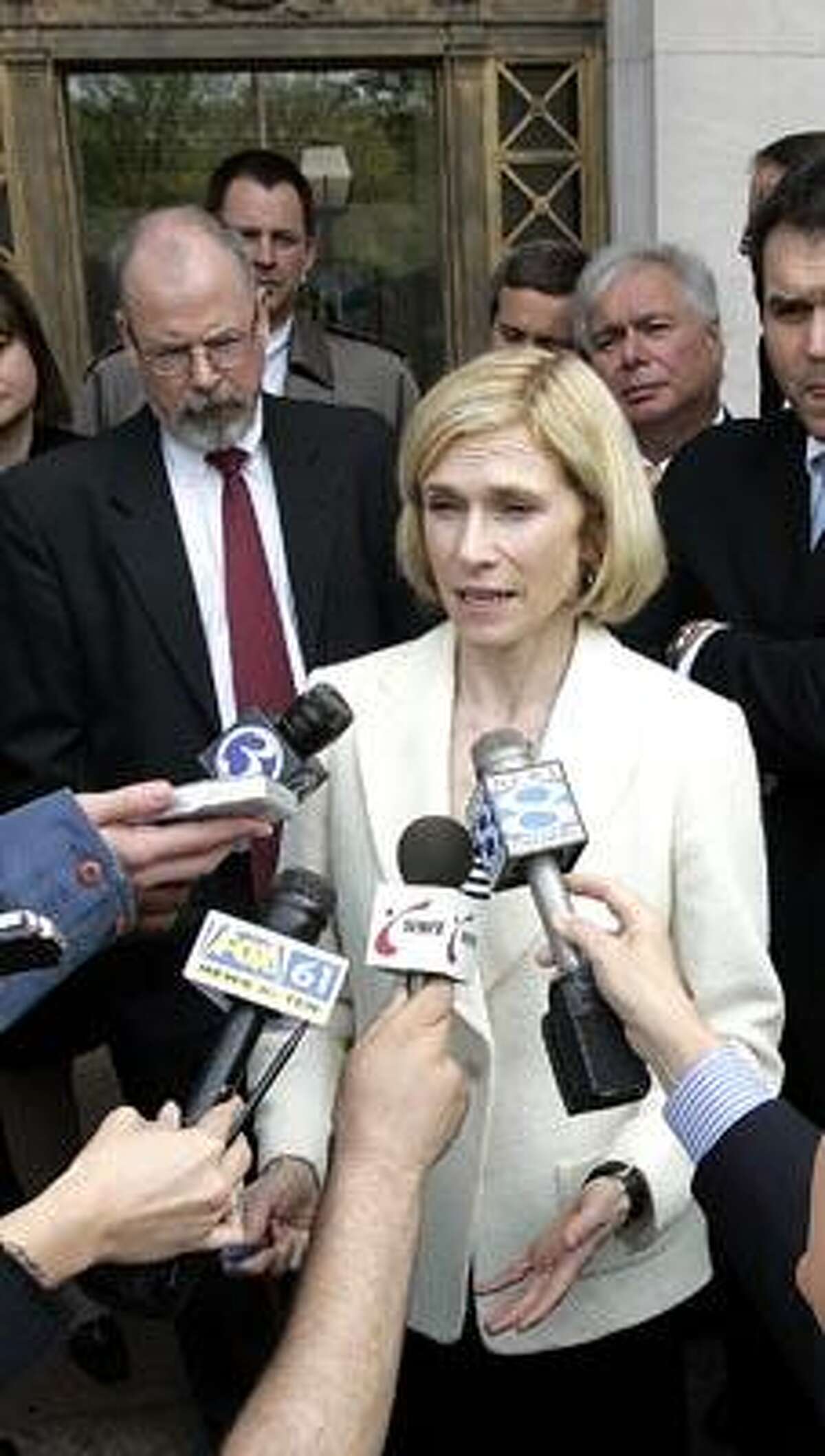 Assistant U.S. Attorney Nora Dannehy speaks with reporters after state contractor William Tomasso and former Connecticut Gov. John G. Rowland's Co-Chief of Staff Peter Ellef were sentenced to 30 months in federal prison on corruption charges Tuesday, April 25, 2006, in New Haven, Conn. (AP Photo/Bob Child)