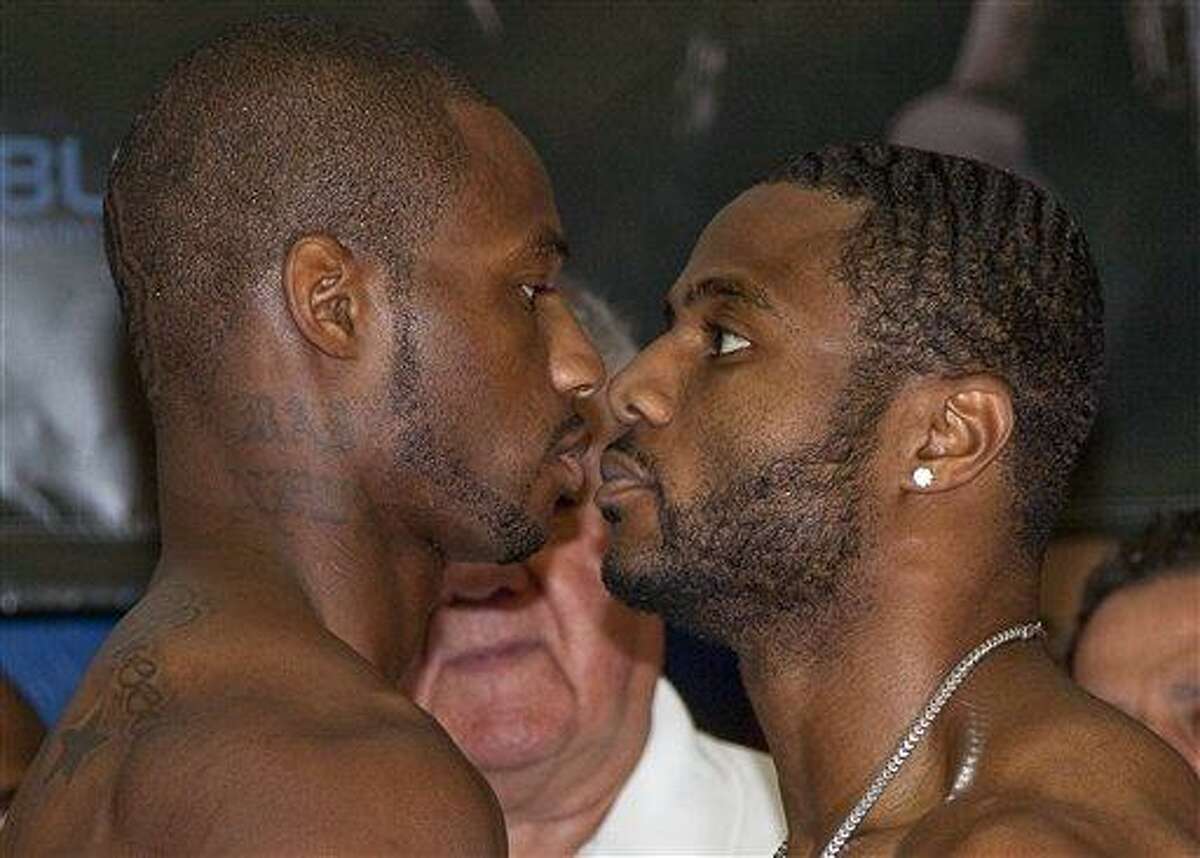 World Boxing Council light heavyweight champion Jean Pascal, right, faces challenger Chad Dawson during the weigh-in Friday, Aug. 13, 2010 in Montreal. The title fight will be Saturday Aug. 14 in Montreal. (AP Photo/The Canadian Press, Paul Chiasson)