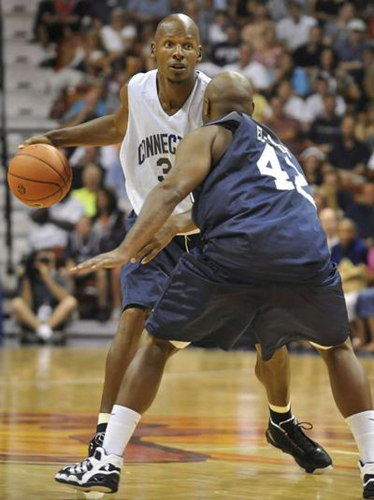 Ray Allen is guarded by Khalid El-Amin during the Jim Calhoun Celebrity Classic Charity All-Star basketball game Saturday in Uncasville. (Associated Press/Jessica Hill)