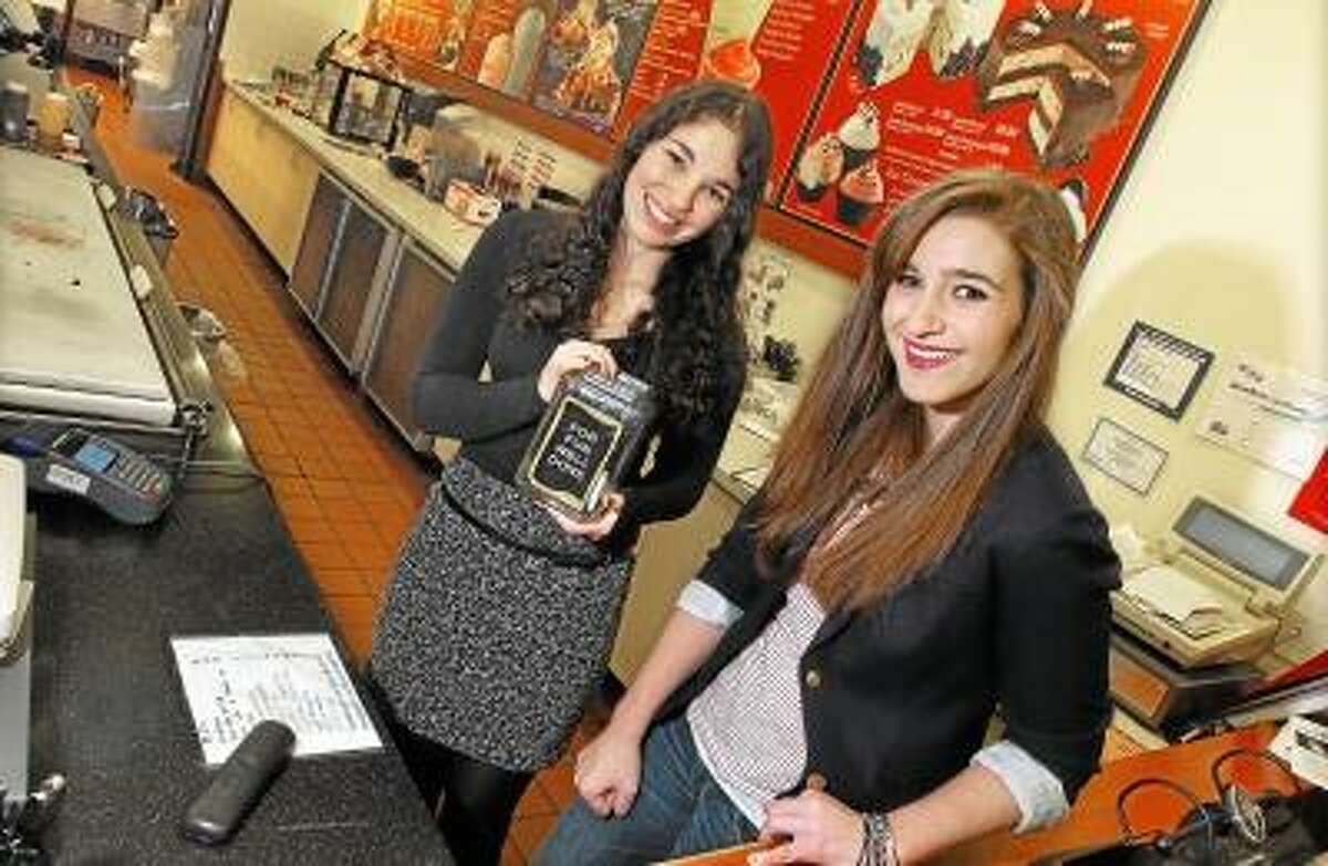 Middletown High School seniors KC Sauer, 17, at right and Lydia Tonkonow, 17, collected over a $1,000 for the Make-A-Wish Foundation selling Make-A-Wish stars and collectively donating their tips for the past year as crew members at Cold Stone Creamery at 100 Riverview Center in Middletown. Sauer and Tonkonow were recognized by the Make-A-Wish Foundation of Connecticut and Mayor Daniel Drew proclaimed today as Lydia Tonkonow and KC Sauer Day in Middletown. Catherine Avalone/The Middletown Press