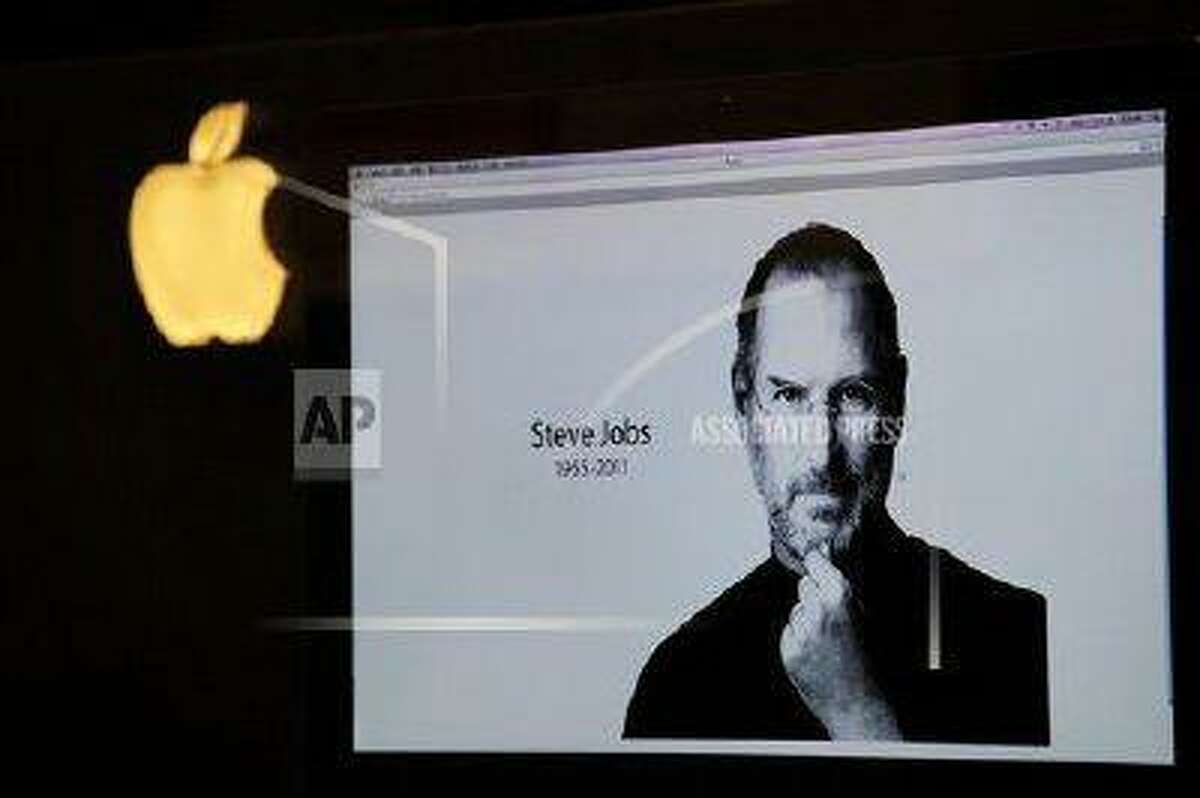 An iMac computer shows the image of Apple co-founder Steve Jobs, who died in 2011 at the age of 56.