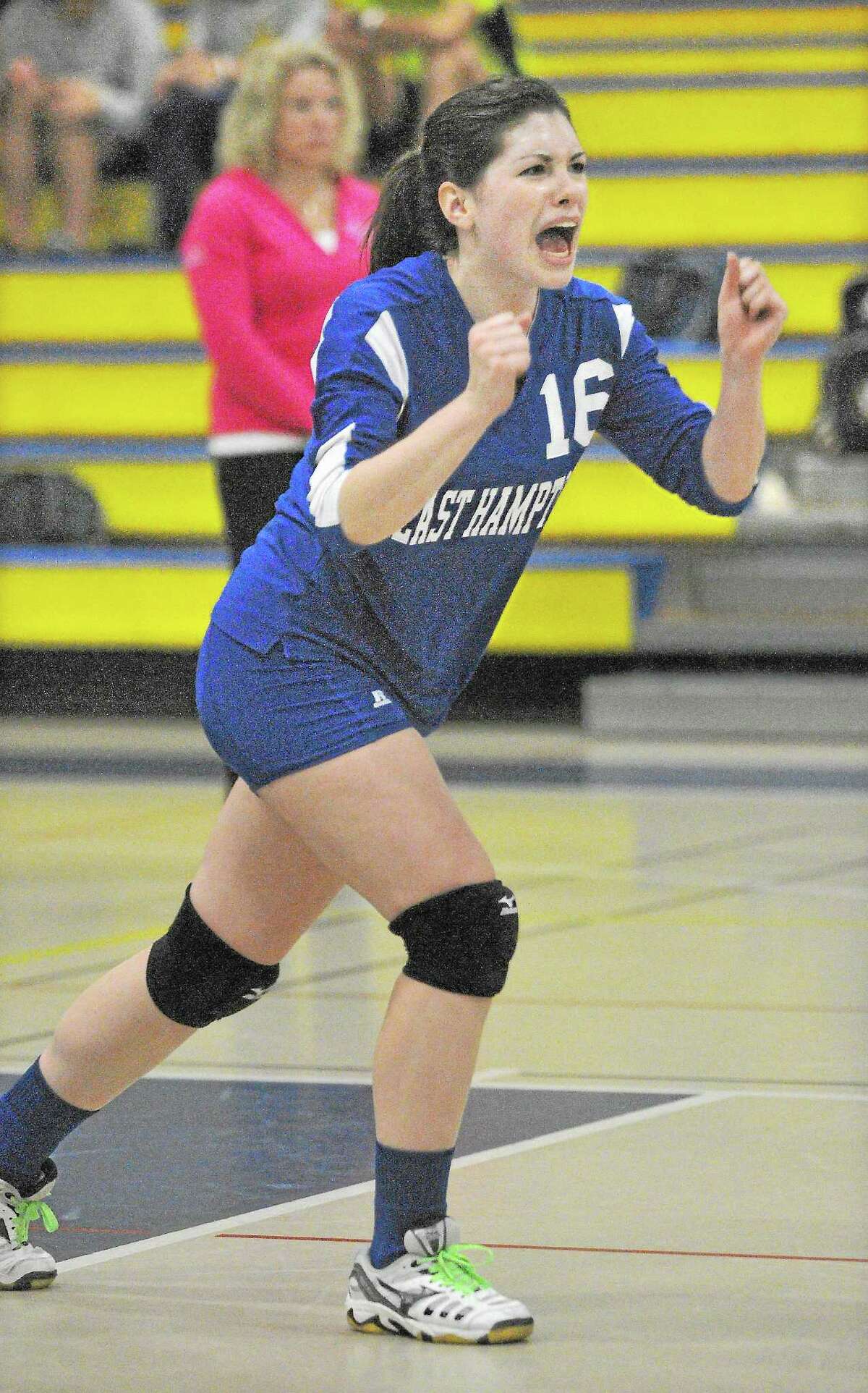 Catherine Avalone — The Middletown Press East Hampton’s Shayla Belanger is pumped after winning the second set, 26-24 against Haddam-Killingworth in a Shoreline Semifinal game Thursday afternoon in Higganum. Haddam-Killingworth won the first set, 25-10 and East Hampton won three sets, 26-24, 25-23 and 27-25. East Hampton won 3-1.