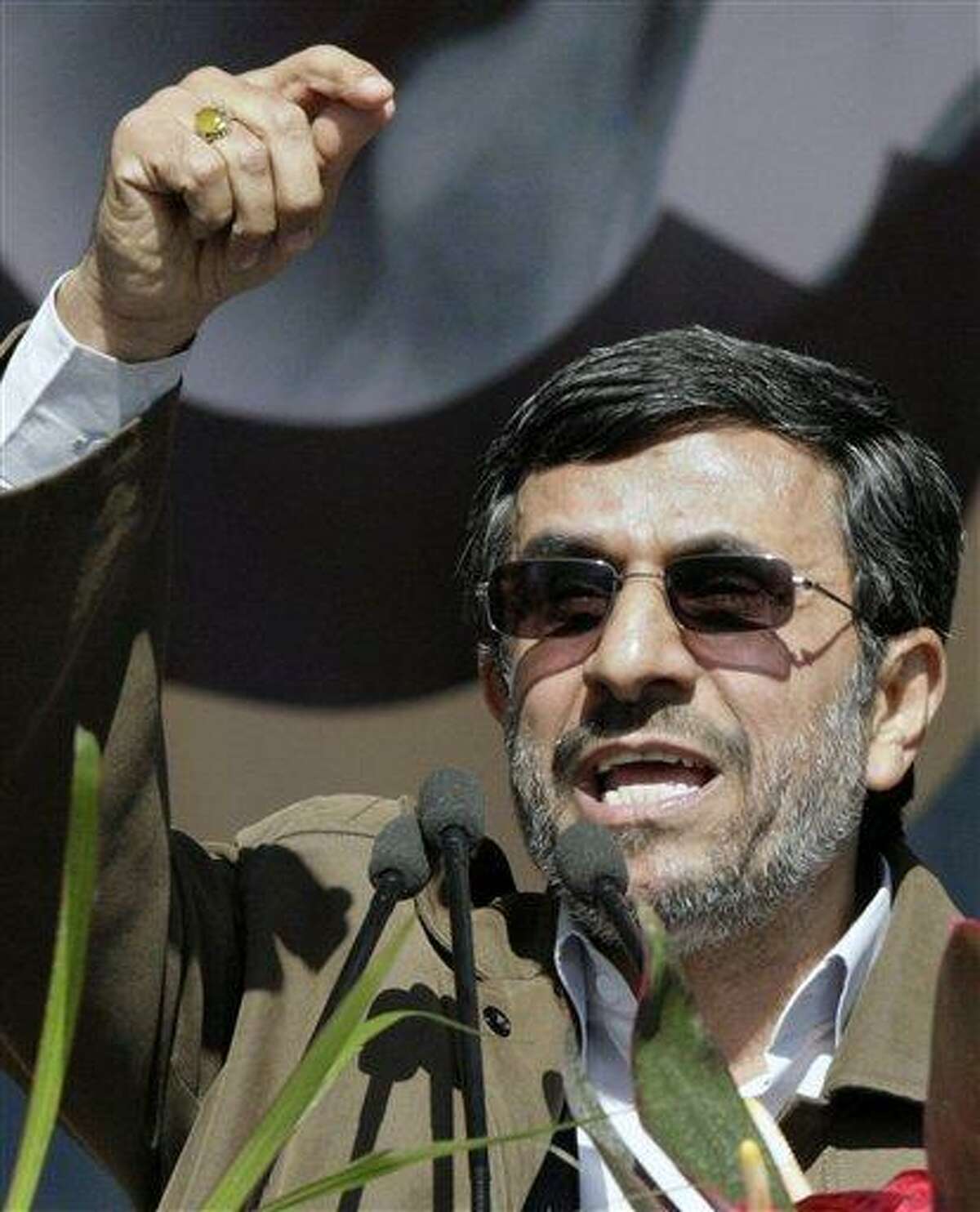 Iranian President Mahmoud Ahmadinejad gestures Saturday as he deliver his speech at a rally to mark the 33rd anniversary of the Islamic Revolution that toppled the country's pro-Western monarchy and brought Islamic clerics to power. Ahmadinejad says Iran will soon reveal "very big new nuclear achievements." Associated Press