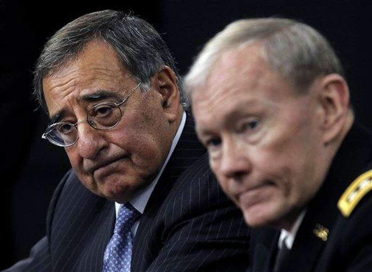 Defense Secretary Leon Panetta and Joint Chiefs Chairman Gen. Martin E. Dempsey outline the main areas of proposed defense spending cuts during a news conference at the Pentagon. Associated Press file photo