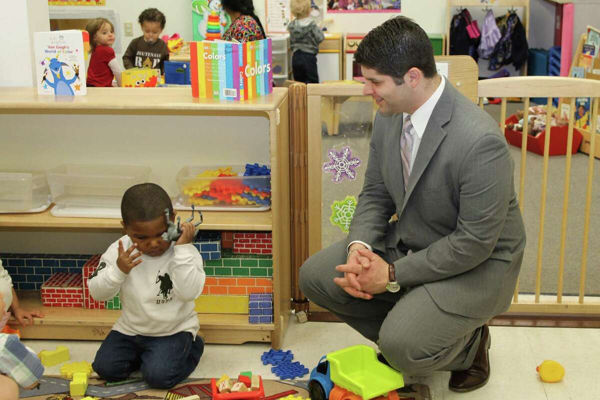 (CT Early Childhood Alliance photo) Phillip, 2, meets Middletown Mayor Dan Drew at the "I Heart Even Start" open house on Valentine's Day.