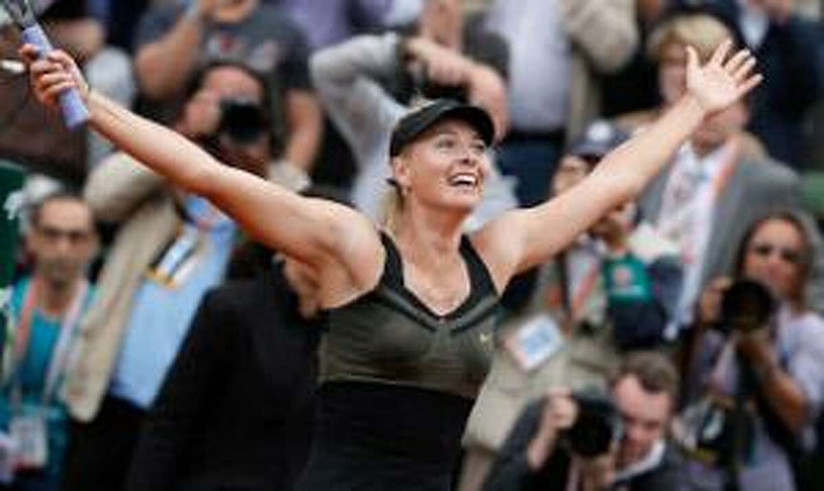 ASSOCIATED PRESS Maria Sharapova of Russia celebrates winning the women's final match against Sara Errani of Italy at the French Open tennis tournament in Roland Garros stadium in Paris on Saturday. Sharapova won in two sets 6-3, 6-2.