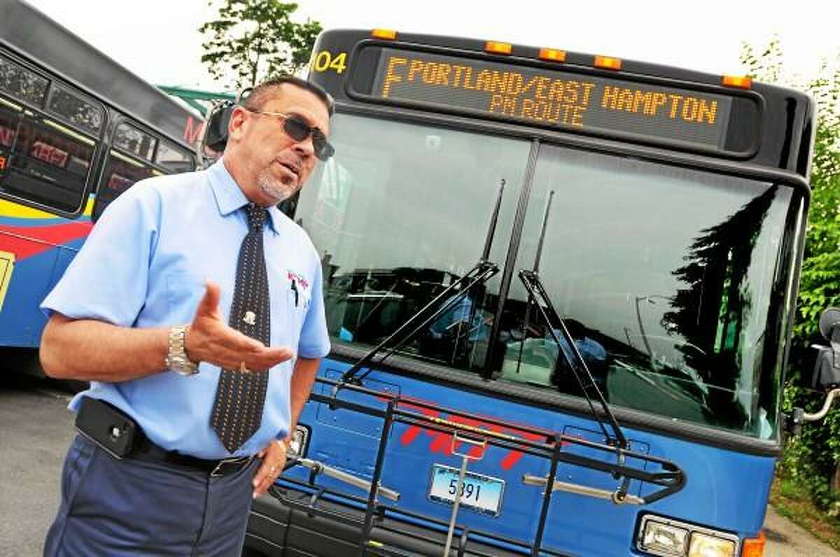 Catherine Avalone/The Middletown Press Middletown Area Transit driver Juan Cuellar drives the Portland-East Hampton route on weekends.