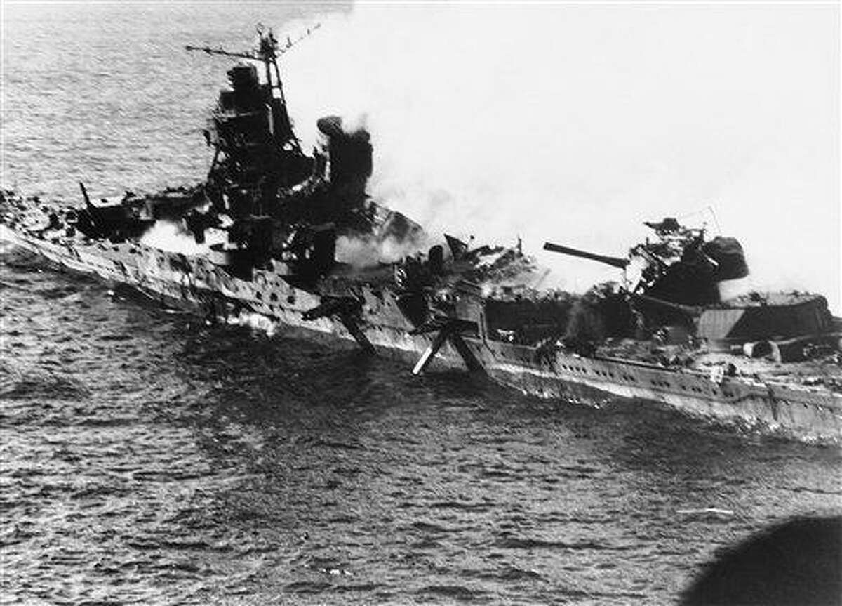In this June 1942 file photo, a Mogami class Japanese cruiser is the flaming target of carrier-based U.S. naval aircraft in the historic battle of Midway which raged for three days in June 1942. Associated Press file photo