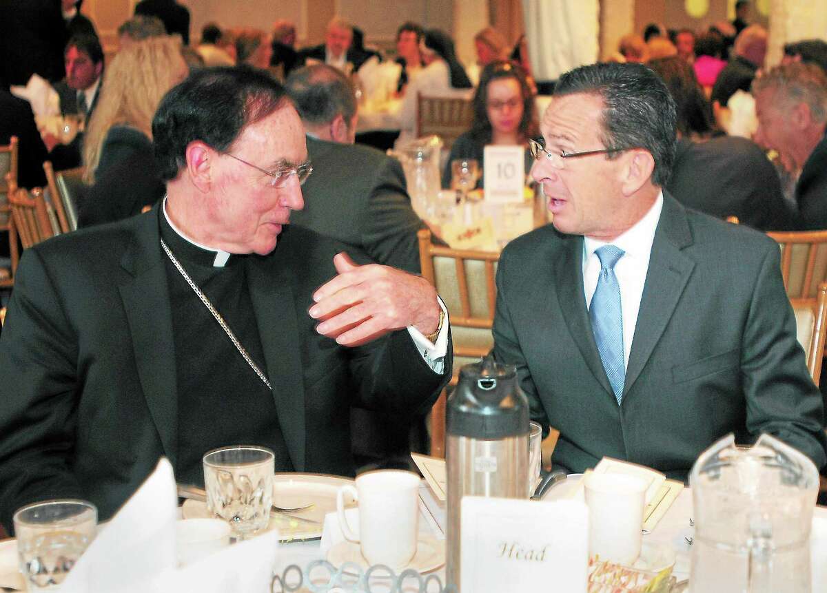 Reverend Henry J. Mansell, Archbishop of Hartford, left, with Governor Dannel P. Malloy during the Archbishop’s Columbus Day Breakfast at Anthony’s Ocean View in New Haven, Conn. Friday morning October 11, 2013. The breakfast is a fundraising benefit to provide scholarship grants to students attending the Catholic elementary schools of the greater New Haven area, sponsored by the Foundation for the Advancement of Catholic Schools.