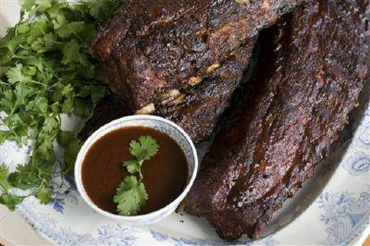 In this image taken on June 3, 2013, Bubba's Bunch barbecued baby back ribs are shown in Concord, N.H. (AP Photo/Matthew Mead)