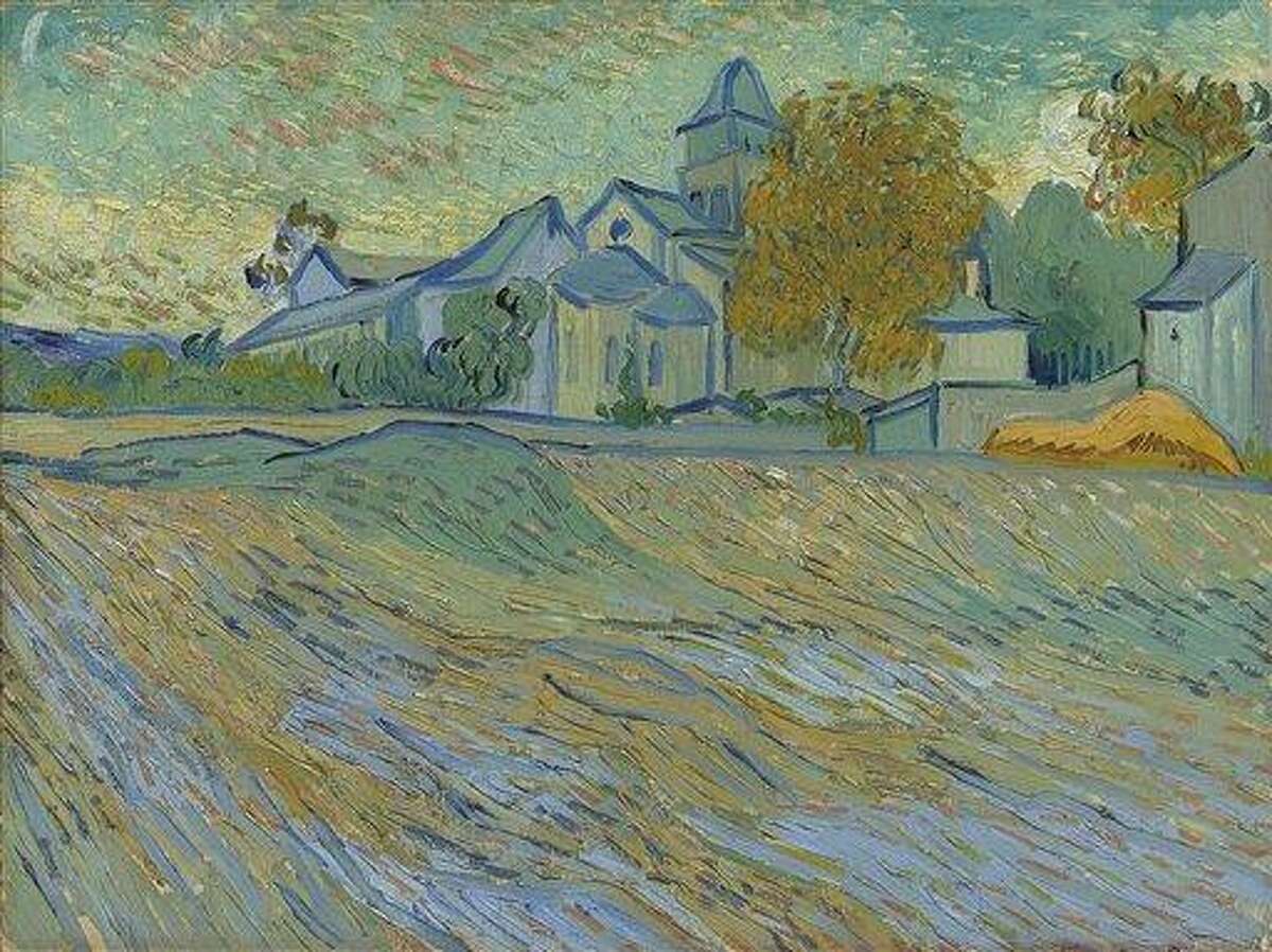 Van Gogh's work Vue de l'asile et de la Chapelle de Saint-Remy sold for nearly $16 million at a sale of paintings from Hollywood star Elizabeth Taylor's art collection Tuesday. Associated Press