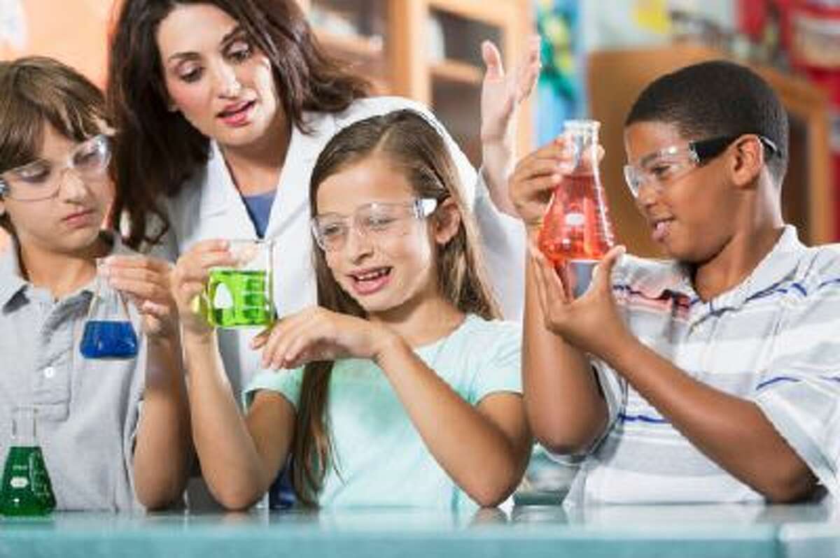 Teacher and students in science lab.