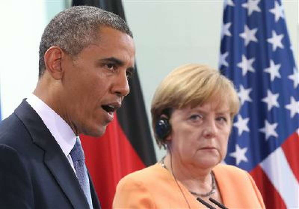 President Barack Obama speaks in June during a press conference with German Chancellor Angela Merkel at the Chancellery in Berlin.