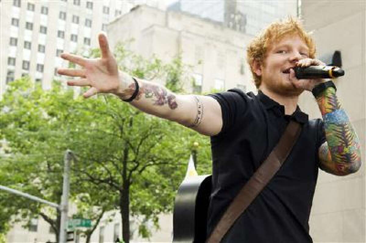 This July 12, 2013 file photo shows Ed Sheeran performing on NBC's "Today" show in New York. Sheeran is part of a breed of newer and lesser known acts who are able to sell out top venues, even if they aren?t selling millions of albums and singles, or dominating with chart-topping tracks and radio airplay.