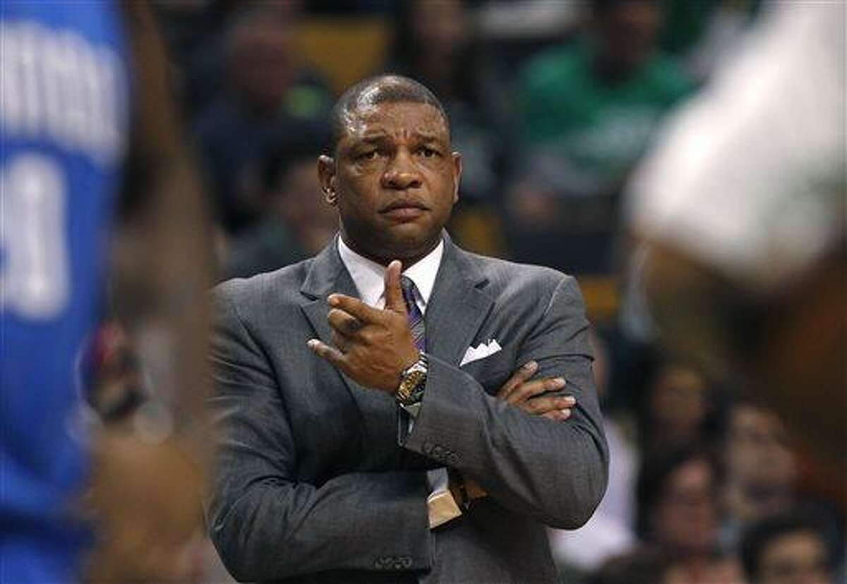 FILE - In this file photo made Feb. 1, 2013, Boston Celtics head coach Doc Rivers gestures towards an official during an NBA basketball game against the Orlando Magic in Boston. A Celtics official told The Associated Press, Sunday, June 23, 2013, that a deal to allow Rivers to coach the Los Angeles Clippers has been agreed to. The official spoke on the condition of anonymity because the deal was contingent on NBA approval and negotiations between Rivers and the Clippers over a new contract. (AP Photo/Charles Krupa, file)