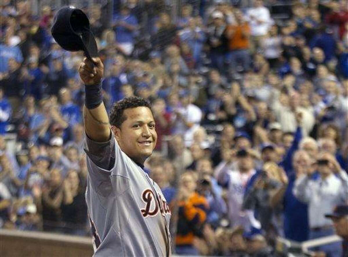 Detroit Tigers' Miguel Cabrera waves to the crowd after being replaced during the fourth inning of a baseball game against the Kansas City Royals at Kauffman Stadium in Kansas City, Mo., Wednesday, Oct. 3, 2012. Cabrera achieved baseball's first Triple Crown since 1967 by leading the league with a .330 average, 44 home runs and 139 RBIs in the regular season. (AP Photo/Orlin Wagner)