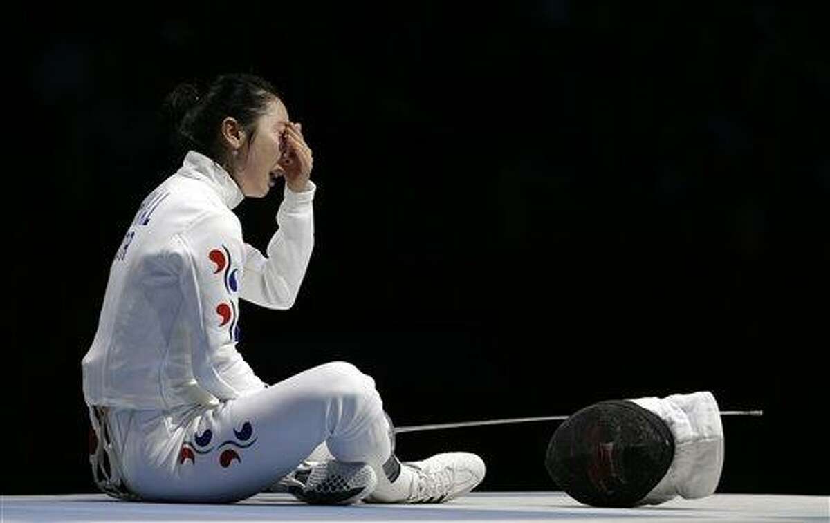 South Korea's Shin A-lam waits for an appeal to an officials decision after a women's individual epee fencing semifinals match against Germany's Britta Heidemann at the 2012 Summer Olympics, Monday, July 30, 2012, in London. (AP Photo/Andrew Medichini)