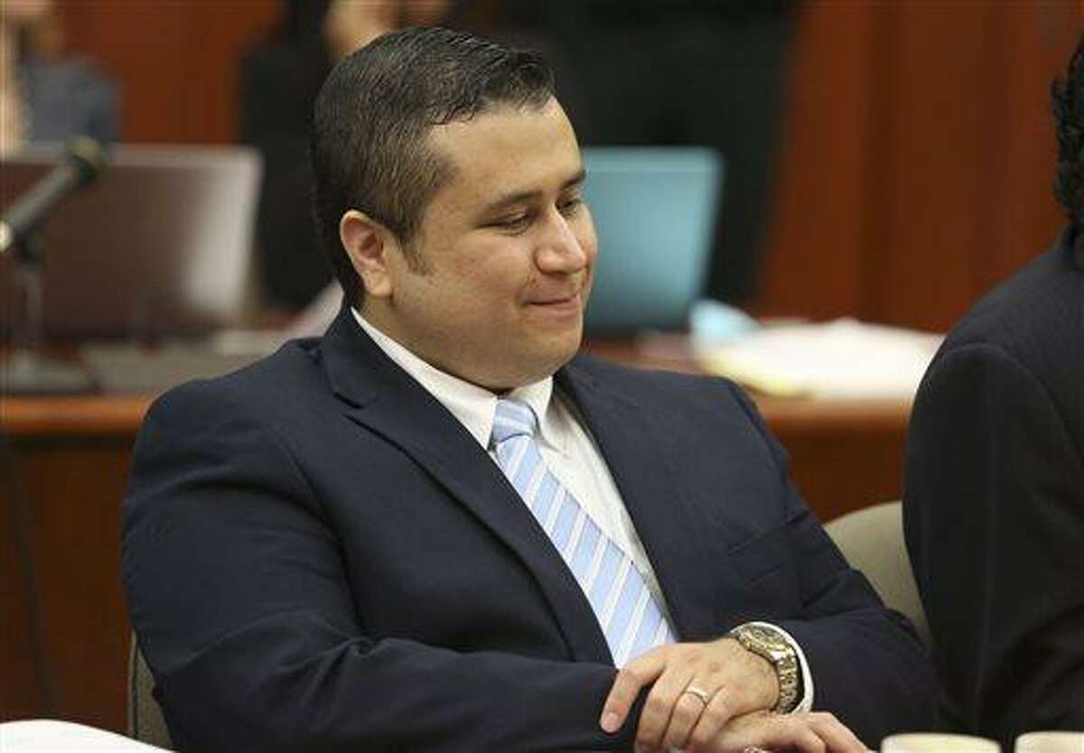 George Zimmerman smiles as attorney Mark O'Mara questions potential jurors for Zimmerman's trial in Seminole circuit court in Sanford, Fla., Thursday, June 20, 2013. Zimmerman has been charged with second-degree murder for the 2012 shooting death of Trayvon Martin. (AP Photo/Orlando Sentinel, Gary Green, Pool)