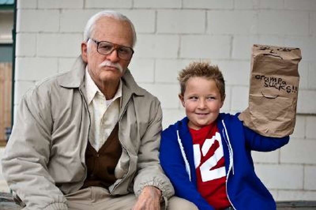 This photo released by Paramount Pictures shows Johnny Knoxville, left, as Irving Zisman and Jackson Nicoll as Billy in "Jackass Presents: Bad Grandpa," from Paramount Pictures and MTV Films.