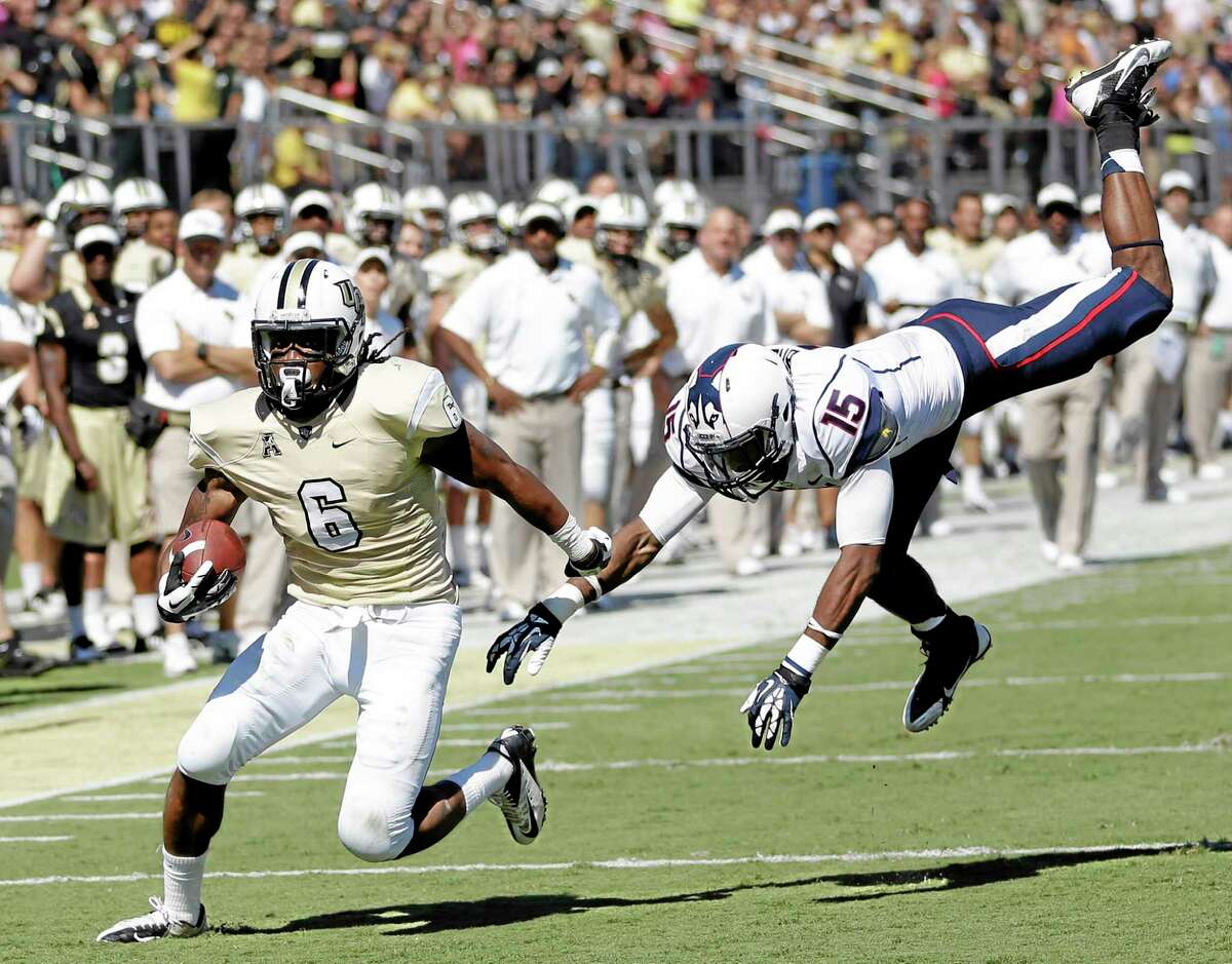 Central Florida wide receiver Rannell Hall runs for a 17-yard touchdown past UConn safety Ty-Meer Brown during the first half Saturday in Orlando, Fla.