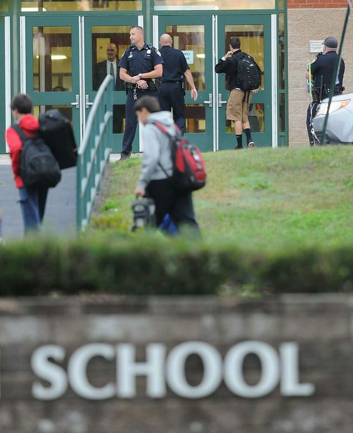 There is an increased police presence at Cheshire High School Tuesday morning after school officials discovered a threat written in a stall in one of the boys' bathrooms there. Peter Hvizdak/Register