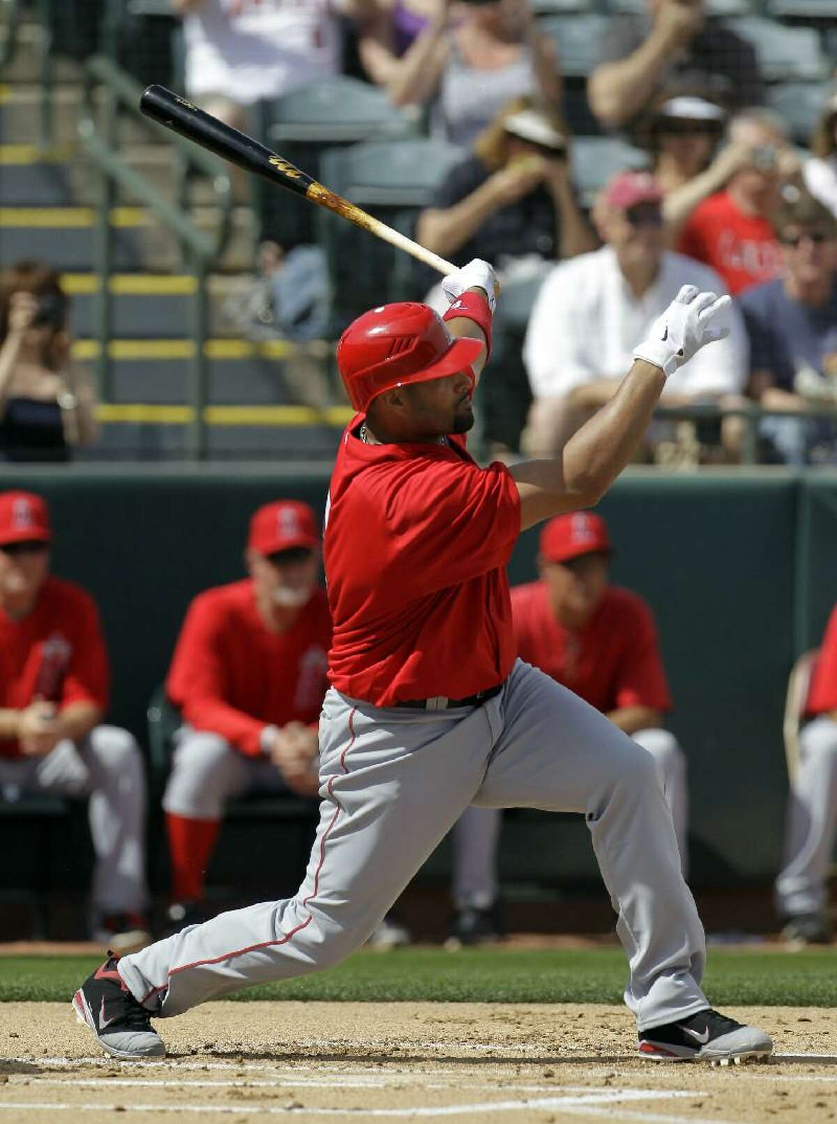 ASSOCIATED PRESS In this March 5 file photo, Los Angeles Angels first baseman Albert Pujols is shown at bat during a spring training game against the Oakland Athletics in Phoenix. Expect an extra wild year in baseball.