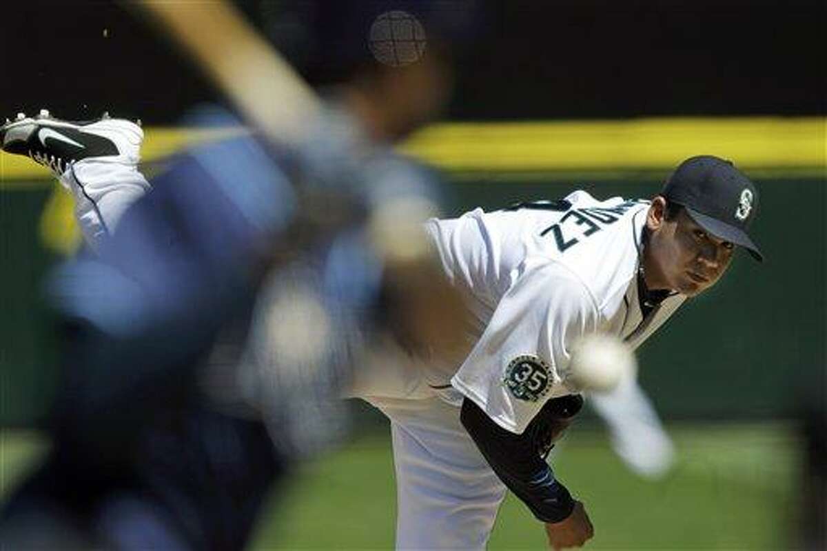 Seattle Mariners starting pitcher Felix Hernandez throws against the Tampa Bay Rays in the fourth inning of a baseball game, Wednesday, Aug. 15, 2012, in Seattle. (AP Photo/Ted S. Warren)