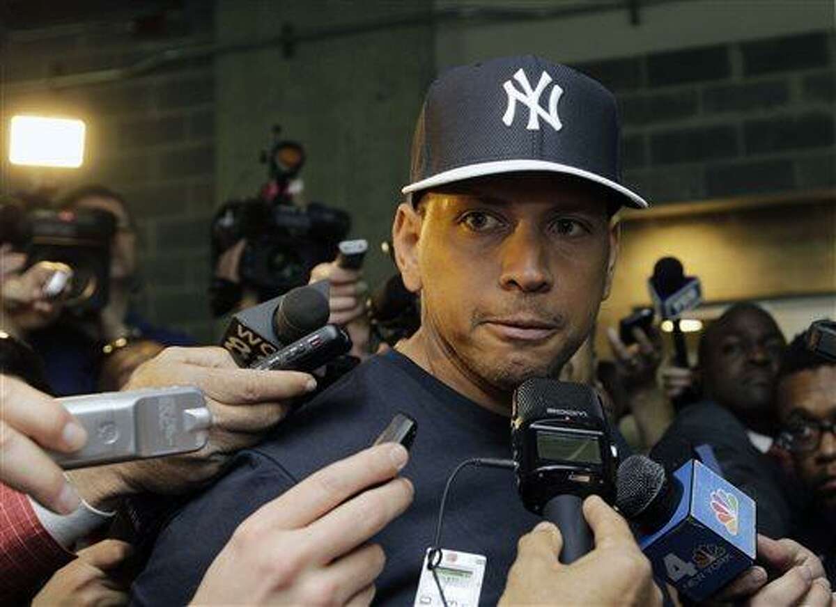 FILE - in this April 1, 2013, file photo, New York Yankees' Alex Rodriguez talks to reporters outside the Yankees' clubhouse in New York. Injuries have kept him off the field for more than half the season and now A-Rod faces discipline from Major League Baseball in its drug investigation, possibly up to a lifetime ban. (AP Photo/Kathy Willens, File)