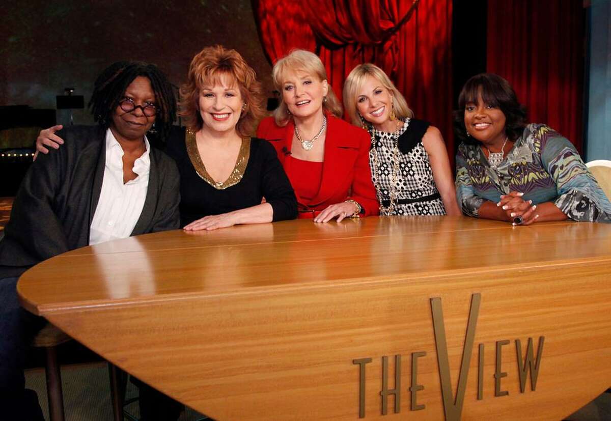 FILE - In this file TV publicity image released by ABC, from left, Whoopi Goldberg, Joy Behar, Barbara Walters, Elizabeth Hasselbeck and Sherri Shepherd pose on the set of their daytime talk show, "The View." Hasselbeck is leaving the desk at "The View" for the couch on Fox News Channel's "Fox & Friends." The news network said Tuesday, July 9, 2013, that Hasselbeck, who has been on Barbara Walters' syndicated daytime show for a decade, will join co-anchors Steve Doocy and Brian Kilmeade on Fox's morning show in September. (AP Photo/ABC, Heidi Gutman, File)