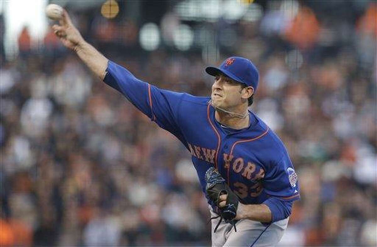 New York Mets pitcher Matt Harvey throws against the San Francisco Giants during the second inning of a baseball game in San Francisco, Monday, July 8, 2013. (AP Photo/Jeff Chiu)