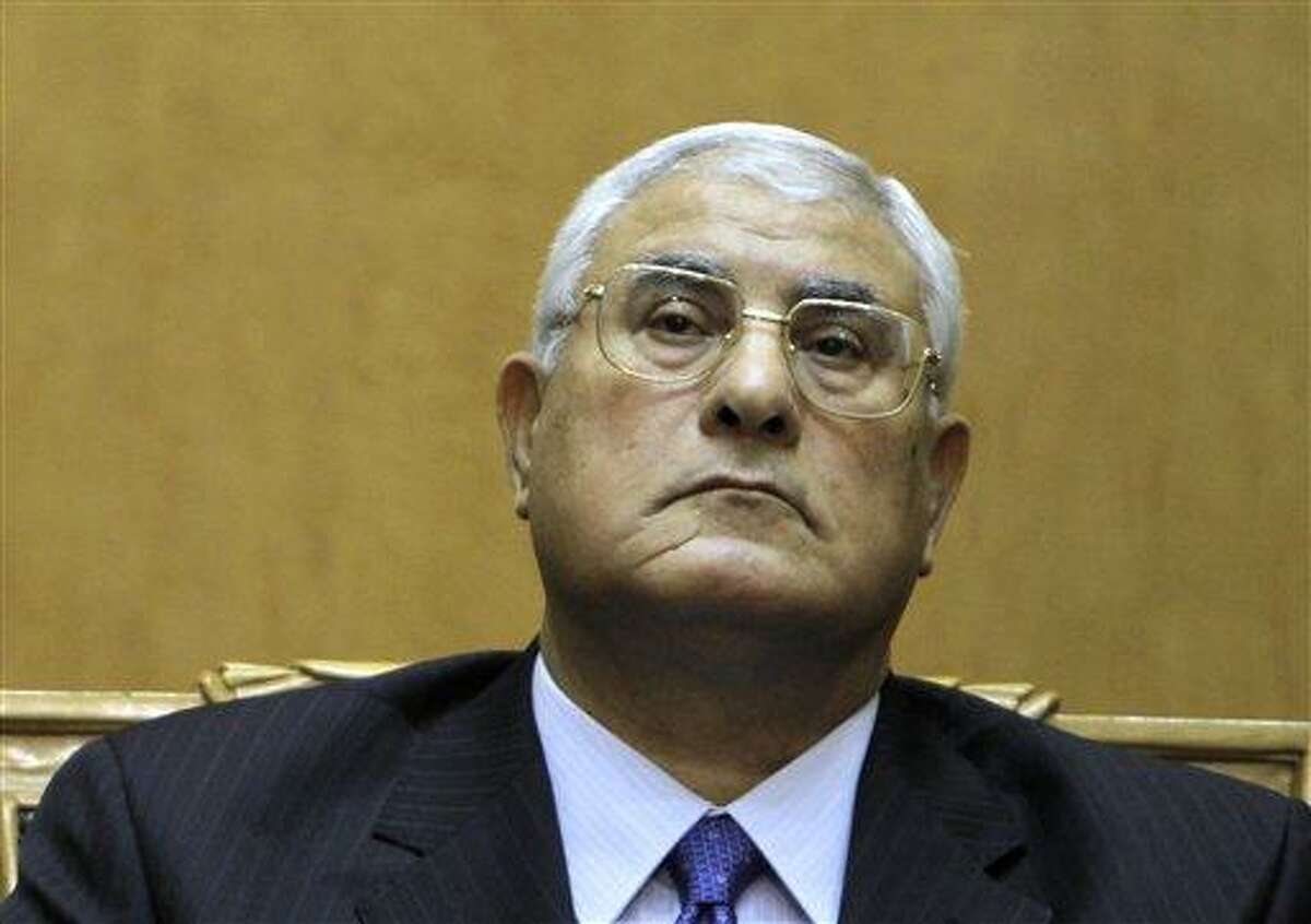 FILE - In this file photo taken Thursday, July 4, 2013, Egypt's chief justice Adly Mansour listens to a speech during his swearing in as interim president. Interim president Mansour held talks Saturday, July 6, 2013, with the army chief and interior minister following an outburst of violence between supporters and opponents of ousted leader Mohammed Morsi that killed at least 36 people across the country and deepened the battle lines in the divided nation. (AP Photo/Amr Nabil, File)