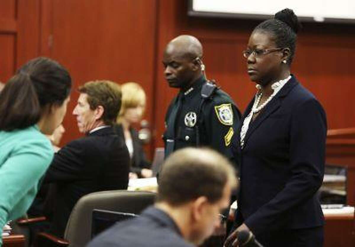 Sybrina Fulton, Trayvon Martin's mother, walks past the defense table after taking the stand during George Zimmerman's trial in Seminole circuit court in Sanford, Florida July 5, 2013. (Gary W. Green/Reuters/Pool)
