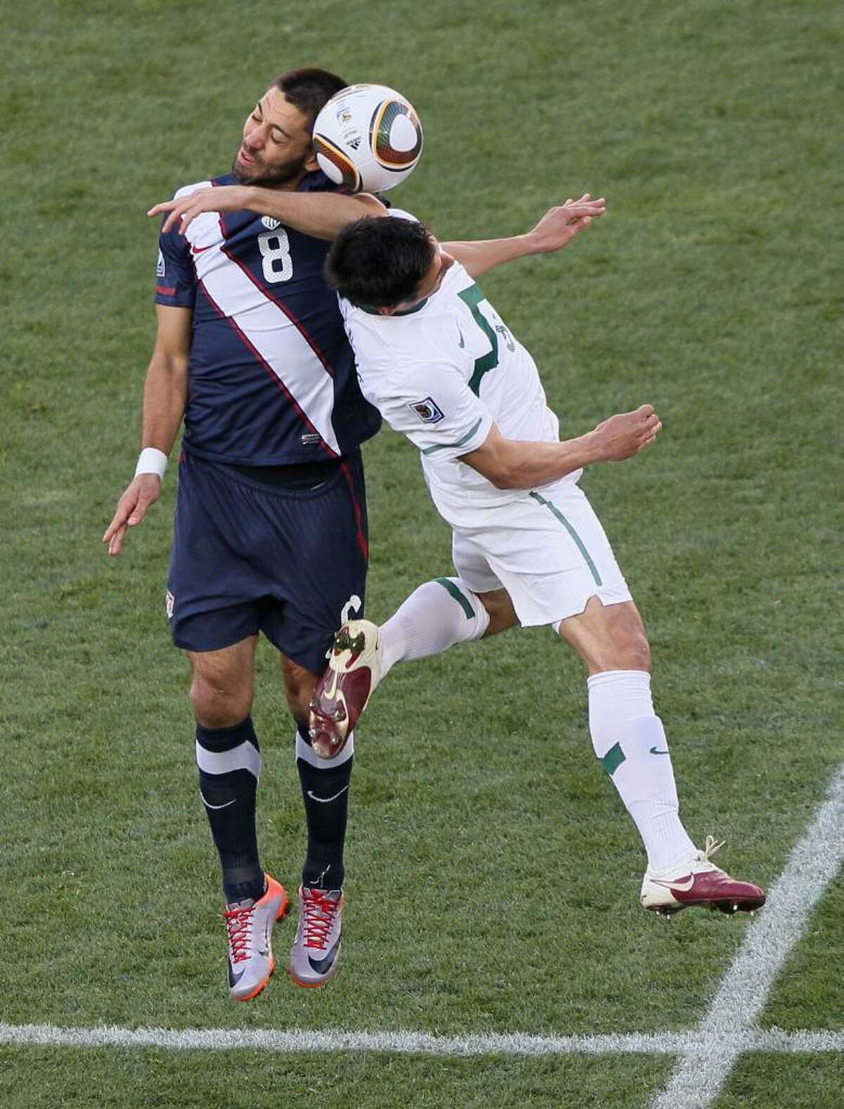 JOHANNESBURG, SOUTH AFRICA - JUNE 18: Clint Dempsey of the United States goes up for a challenge with Zlatan Ljubijankic of Slovenia during the 2010 FIFA World Cup South Africa Group C match between Slovenia and USA at Ellis Park Stadium on June 18, 2010 in Johannesburg, South Africa. (Photo by Christof Koepsel/Getty Images) *** Local Caption *** Clint Dempsey;Zlatan Ljubijankic