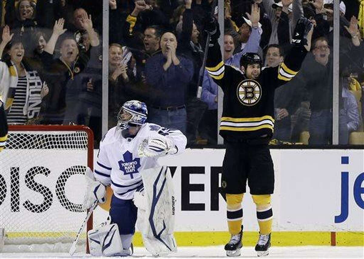 Boston Bruins right wing Nathan Horton, right, celebrates his goal against Toronto Maple Leafs goalie James Reimer (34) in the first period in Game 1 of a first-round NHL hockey playoff series in Boston, Wednesday, May 1, 2013. (AP Photo/Elise Amendola)