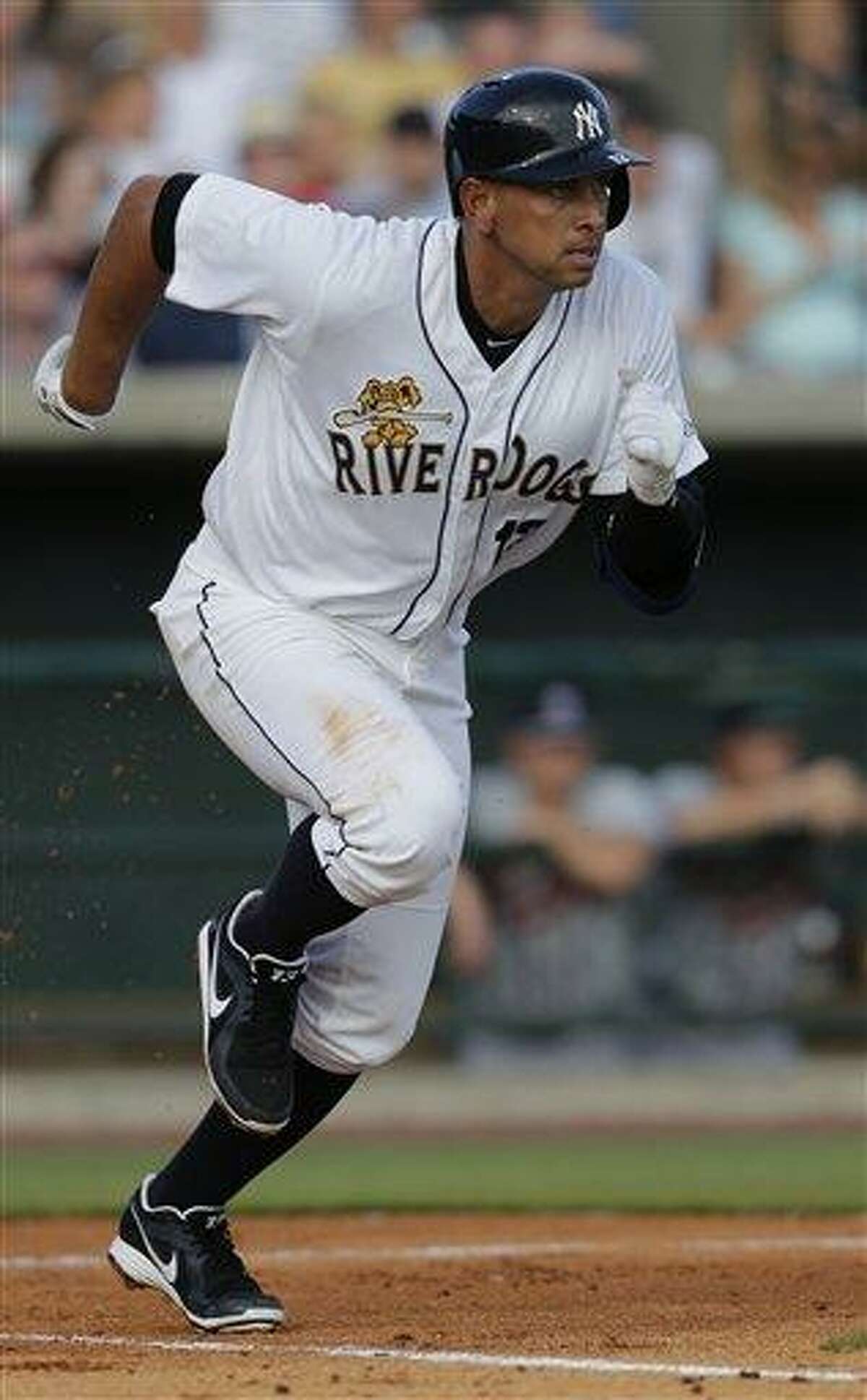 New York Yankees' Alex Rodriguez runs out a ground ball in the first inning in his second rehab game with the Charleston RiverDogs in Charleston, S.C., Wednesday, July 3, 2013. (AP Photo/Chuck Burton)