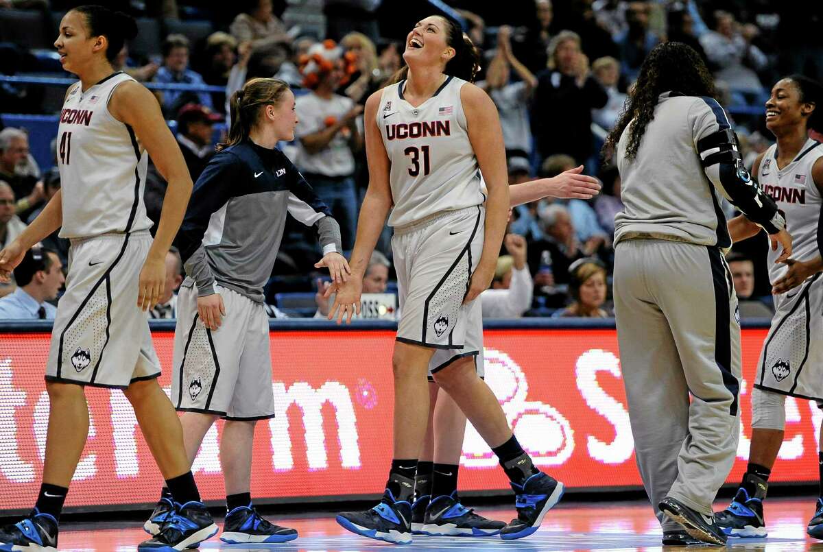 UConn’s Stefanie Dolson walks to the bench during a timeout in the second half of Wednesday’s game against Oregon in Hartford. Dolson finished the game with 26 points, 14 rebounds and 11 assists for the second triple-double in UConn’s history.