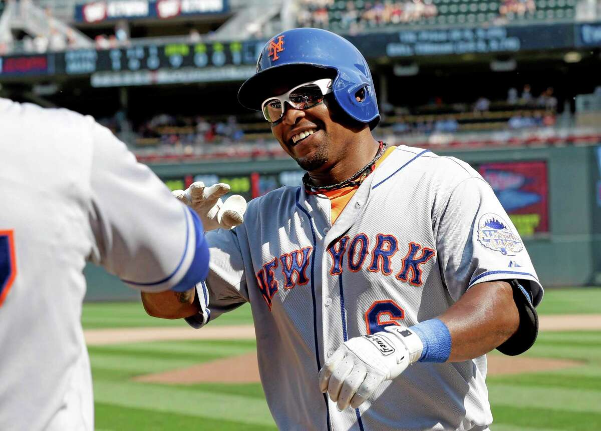 New York Mets' Marlon Byrd is all smiles after his solo home run off Minnesota Twins pitcher Jared Burton in the ninth inning of a baseball game, Monday, Aug. 19, 2013 in Minneapolis. The Mets won 6-1. (AP Photo/Jim Mone)