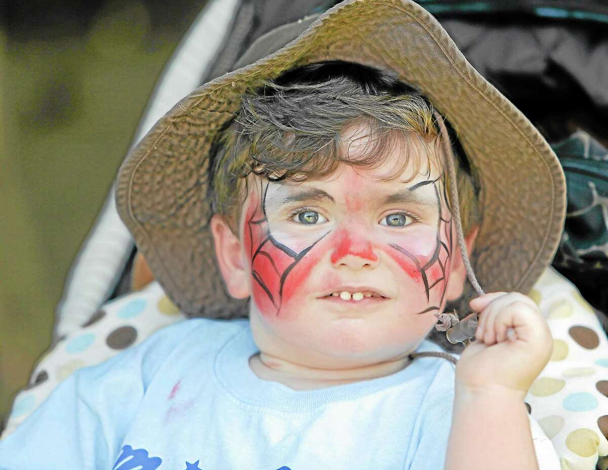 Evan Napp is proud of his Spiderman "mask" his he had face painted at Sunday's Open Air Market at Wadsworth Mansion.