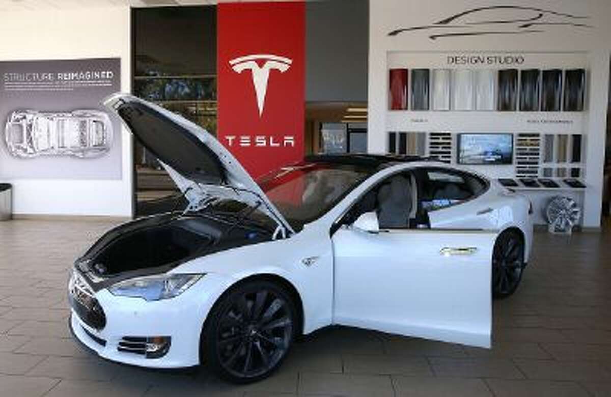 A Tesla Model S car is displayed at a Tesla showroom in Palo Alto, Calif.