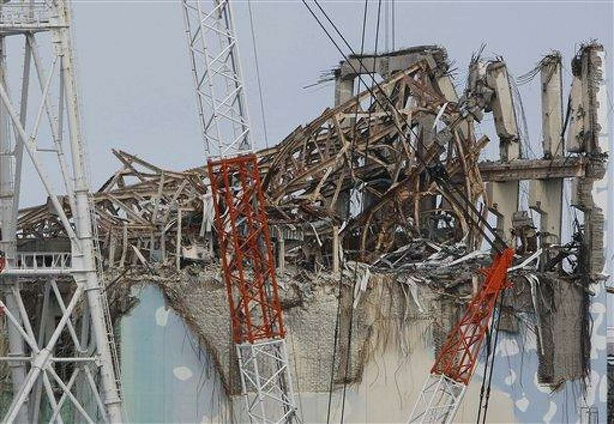 AP FILE - In this Feb. 20, 2012 file photo, damaged Unit 3 reactor building of Tokyo Electric Power Co.'s tsunami-crippled Fukushima Dai-ichi nuclear power plant is seen in Fukushima prefecture, northeastern Japan. The cooling system failed for a storage pool for fuel at one of the reactors at the tsunami-damaged nuclear plant in northeastern Japan Friday, April 5, 2013 - the second in a month, although there was no immediate danger from the breakdown. Nuclear Regulation Authority spokesman Takahiro Sakuma said an alarm went off in the afternoon about the problem at reactor No. 3. The cause was still under investigation. (AP Photo/Issei Kato, File)