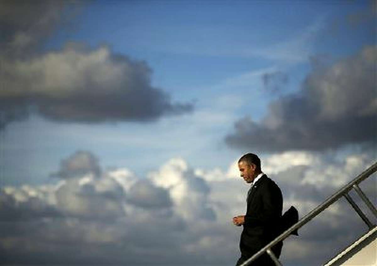 President Barack Obama steps off Air Force One upon his arrival Nov. 8 at Miami International Airport. Obama traveled to the south Florida area for three Democratic fundraisers.