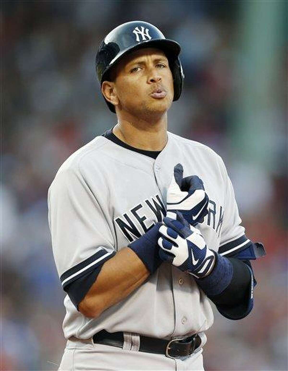 New York Yankees' Alex Rodriguez reacts after flying out in the eighth inning of a baseball game against the Boston Red Sox in Boston, Saturday, Aug. 17, 2013. (AP Photo/Michael Dwyer)