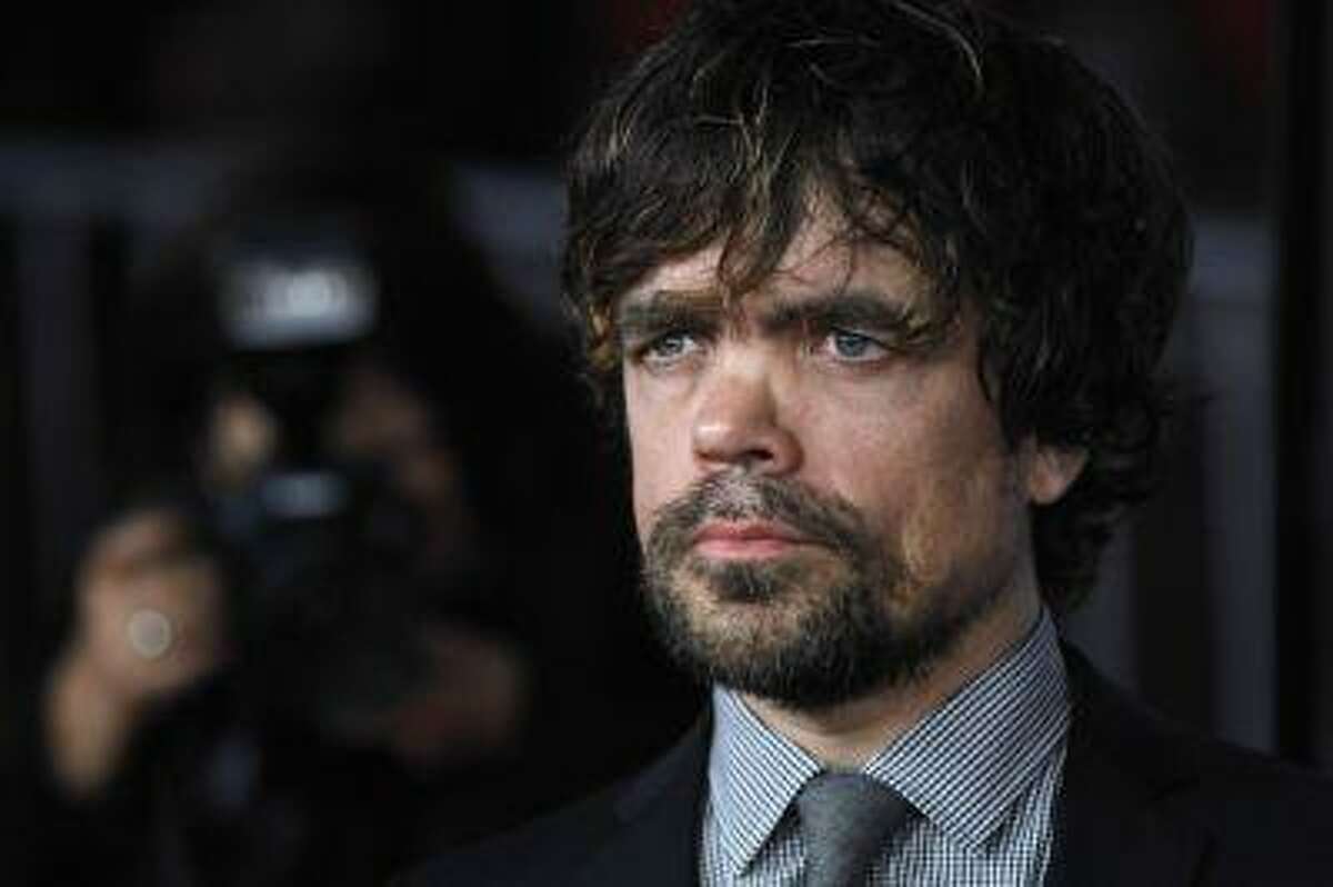Cast member Peter Dinklage poses at the premiere for the third season of the television series "Game of Thrones" in Hollywood, California March 18, 2013. The third season debuts on HBO on March 31. REUTERS/Mario Anzuoni (UNITED STATES - Tags: ENTERTAINMENT)