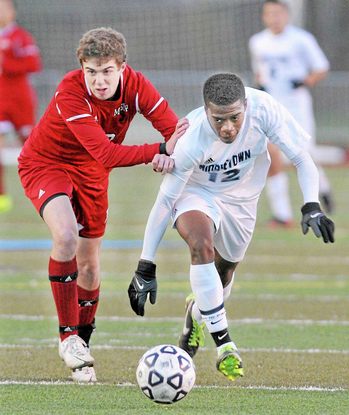 Middletown senior Lucas Saunders drives past Masuk junior Nicholas Zacchilli toward the Masuk goal Tuesday afternoon. Masuk defeated Middletown 2-0 in the CIAC Class L First Round.