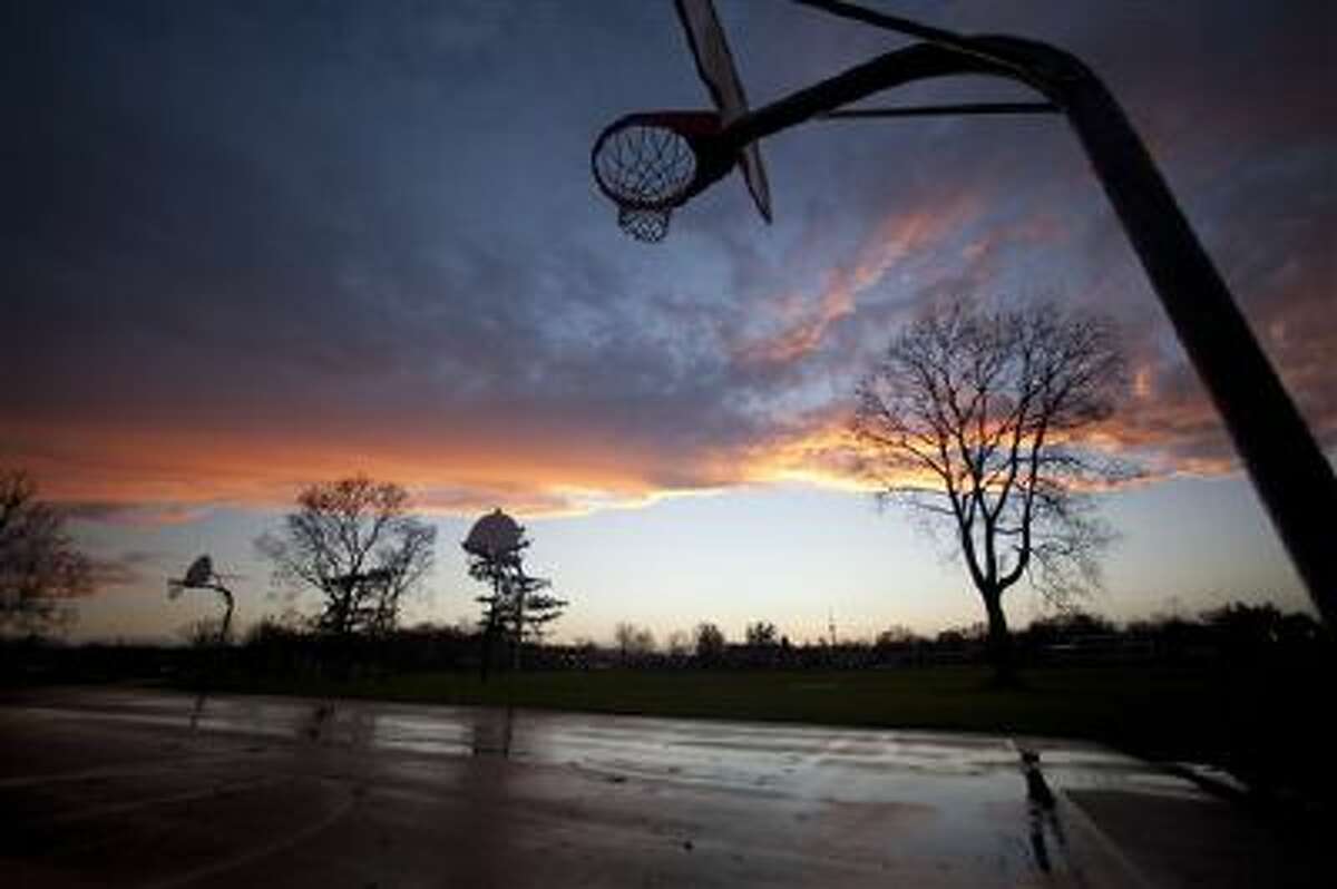 A sunset glows following high winds and storms on this Michigan playground.