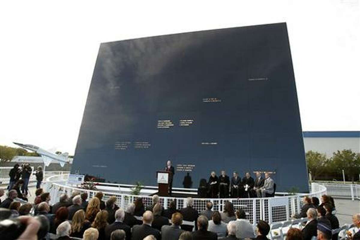 Stephen Feldman, at podium, president and CEO of the Astronauts Memorial Foundation speaks in front of the memorial during a rememberance ceremony to mark the 25th Anniversary of space shuttle Challenger explosion at the Kennedy Space Center visitor complex in Cape Canaveral, Fla., Friday, Jan. 28, 2011. (AP Photo/John Raoux)