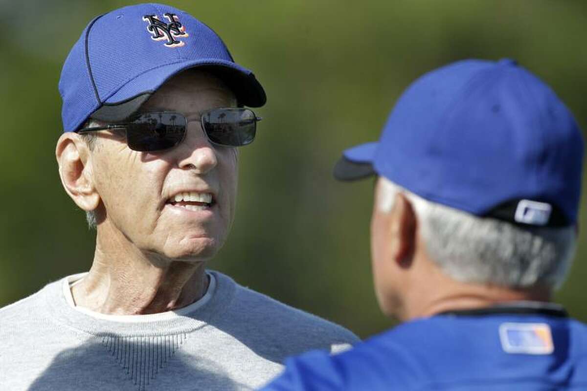 New York Mets owner Fred Wilpon, left, talks with manager Terry Collins during spring training baseball Saturday, Feb. 19, 2011, in Port St. Lucie, Fla. (AP Photo/Jeff Roberson)