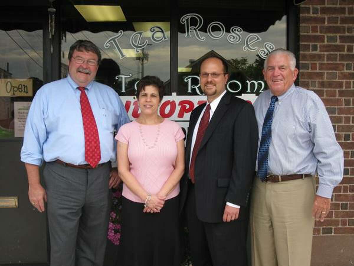 From left to right, Cromwell First Selectman John Flanders, Tea Roses Tea Room owner Peggi Camosci, Middlesex Chamber Cromwell Division chairman Michael Camilleri and chamber president Larry McHugh are pictured at Tea Roses Tea Room's grand opening event on June 22 in Cromwell.