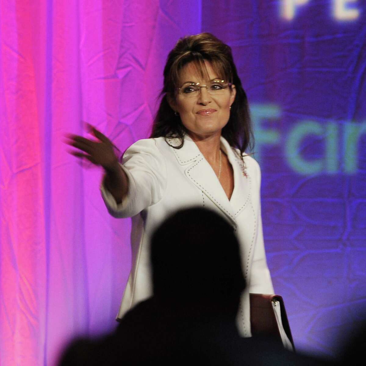 Former vice presidential candidate Sarah Palin acknowledges members of the Pennsylvania Family Institute as she walks on stage to give a speech Friday, Aug. 27, 2010 in Hershey, Pa. (AP Photo/Bradley C Bower)